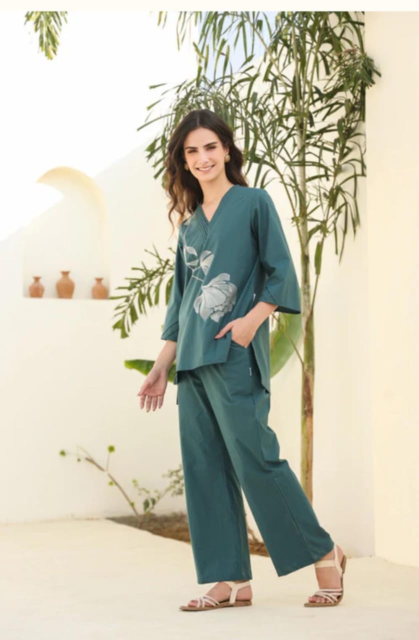 Trendy teal co-ord set with subtle floral print. Comfortable wide-leg pants paired with stylish top make it perfect for casual outings.