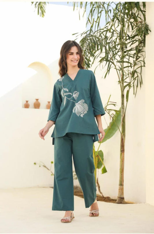 Trendy teal co-ord set with subtle floral print. Comfortable wide-leg pants paired with stylish top make it perfect for casual outings.