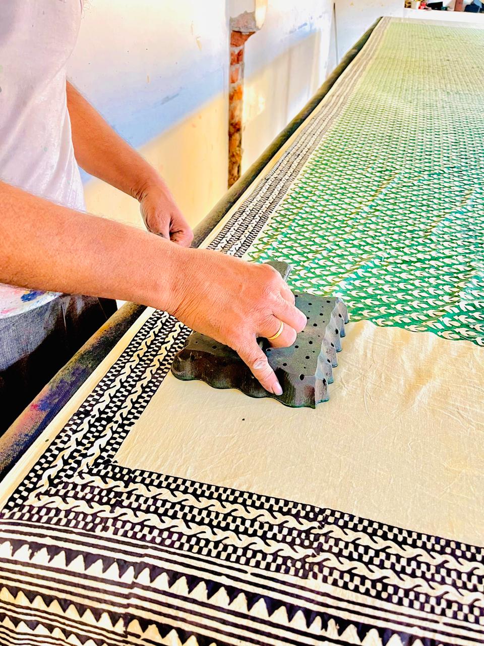 Artisan applying natural dyes