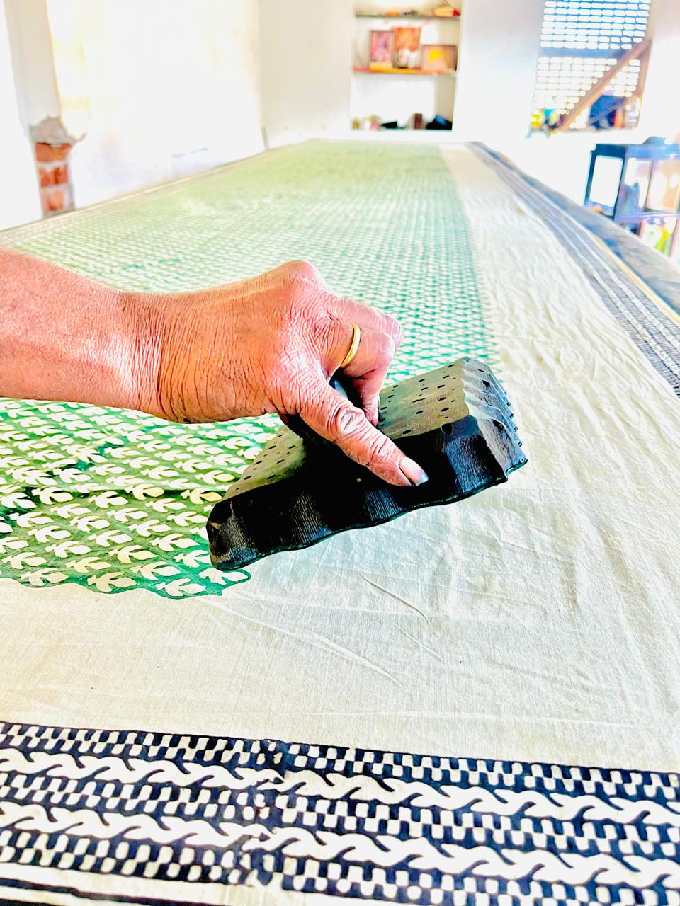 Artisan working with hand-carved block prints